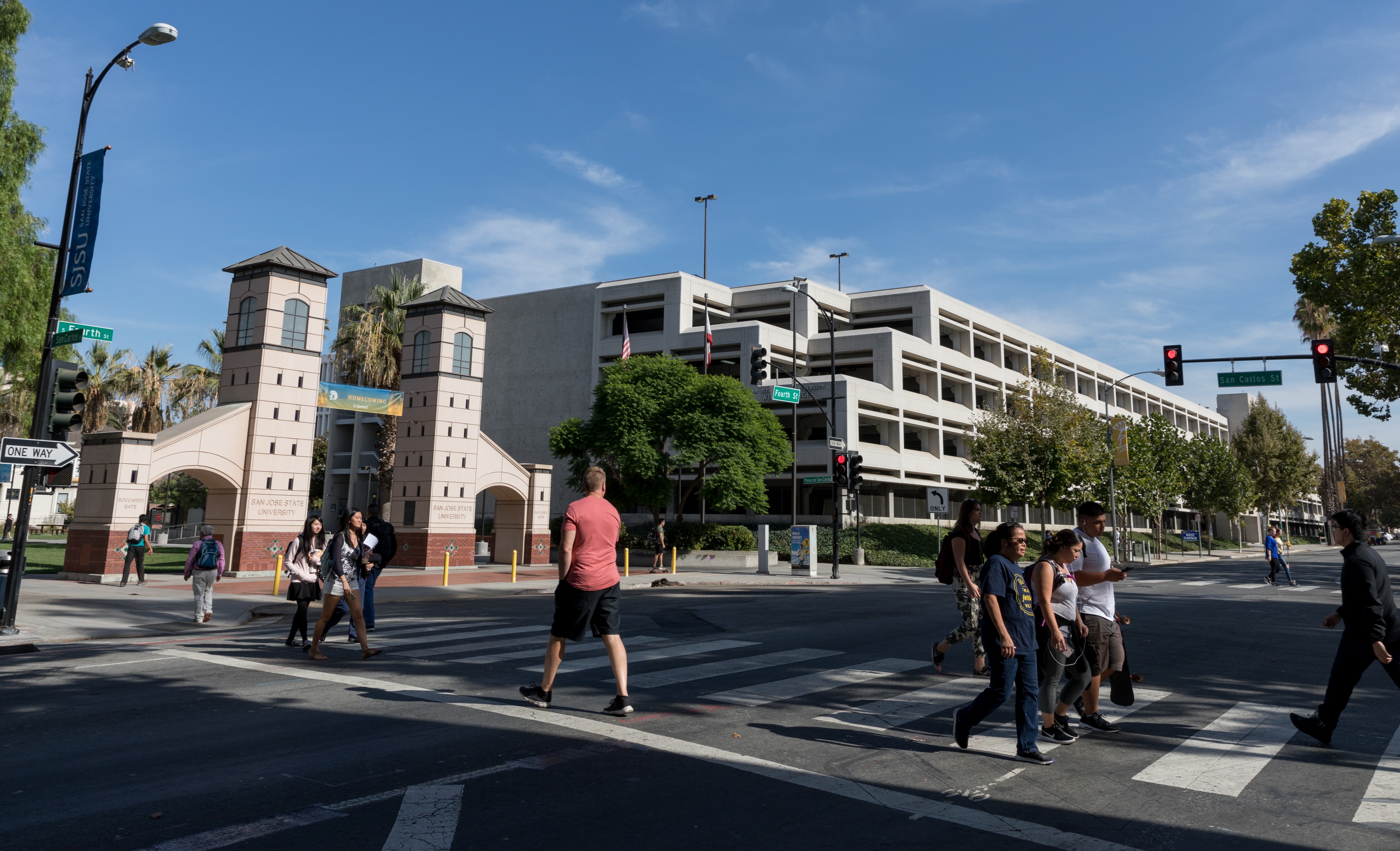 Visitors crossing the street onto the SJSU campus